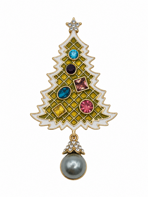 A Christmas tree-shaped brooch with a gold-tone frame, white enamel sections, yellow-green grid detailing, multicolored faceted gemstones, and a dangling gray pearl at the bottom, shown on a plain white background.