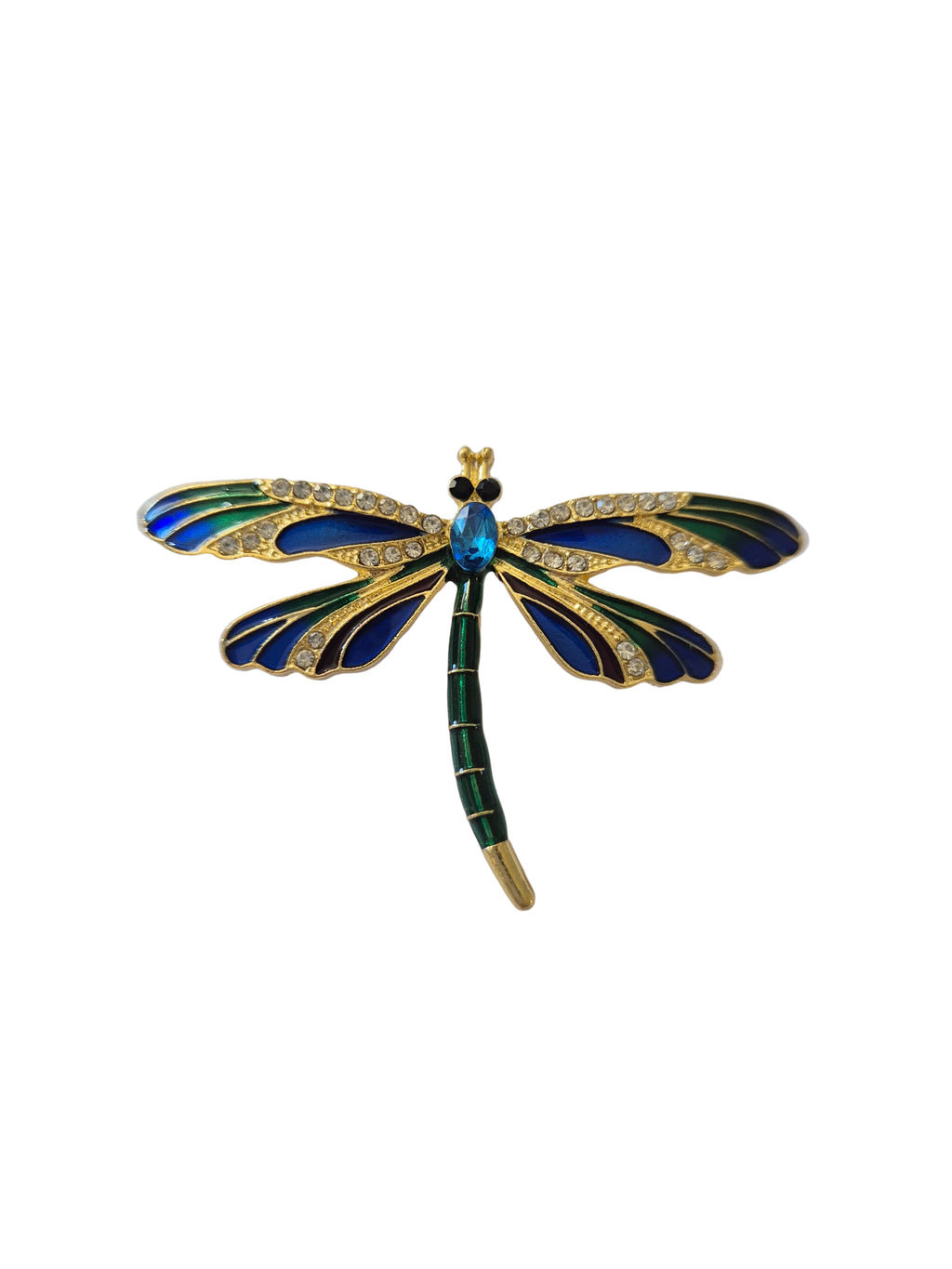 Dragonfly-shaped brooch with blue and green details on a white background