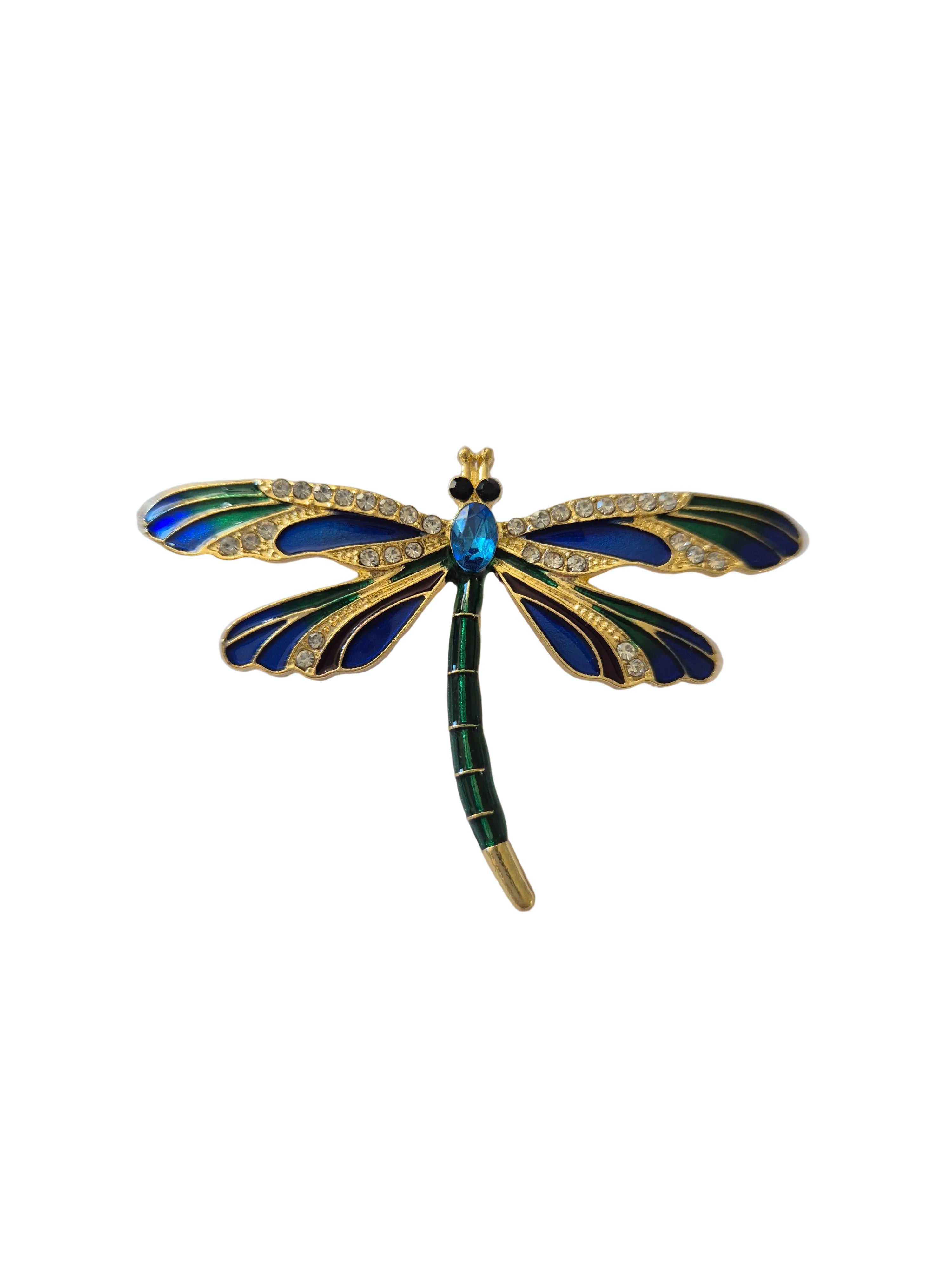 Dragonfly-shaped brooch with blue and green details on a white background