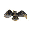 An owl-shaped brooch with black and gold-tone metal detailing, featuring textured wings and a gold-tone beaded outline, photographed on a plain white background.