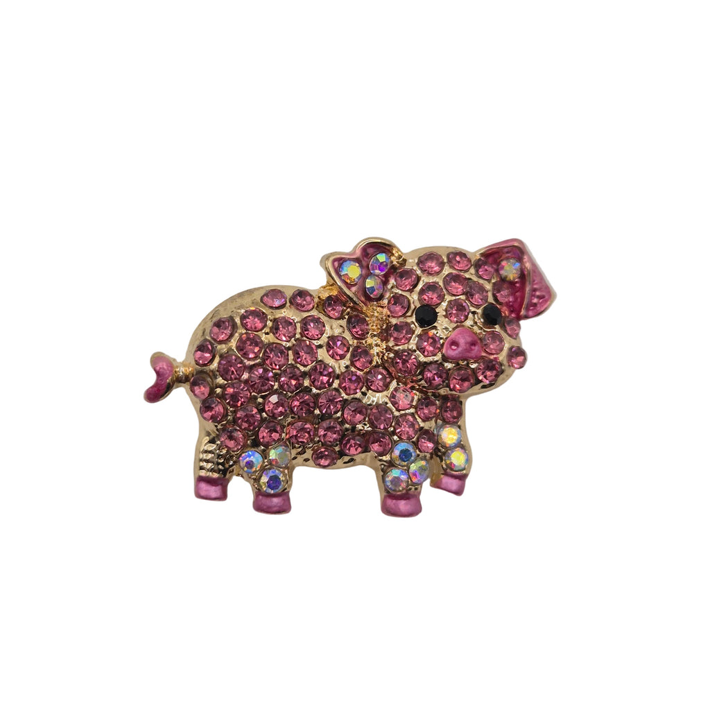 Rhinestone pig brooch with pink gemstones on a white background