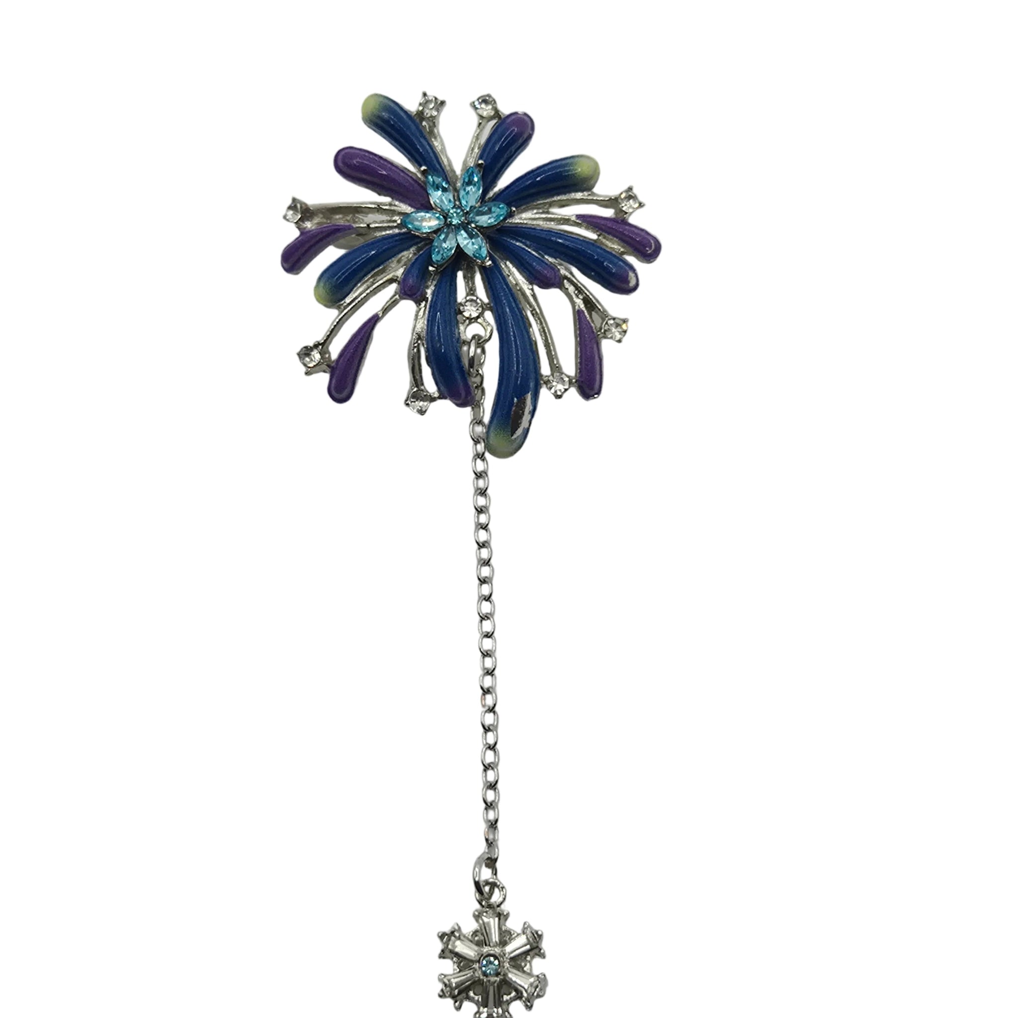 A blue toned firework brooch with small clear rhinestones, and a dangling chain ending in a snowflake-shaped silver-toned charm, shown on a plain white background.