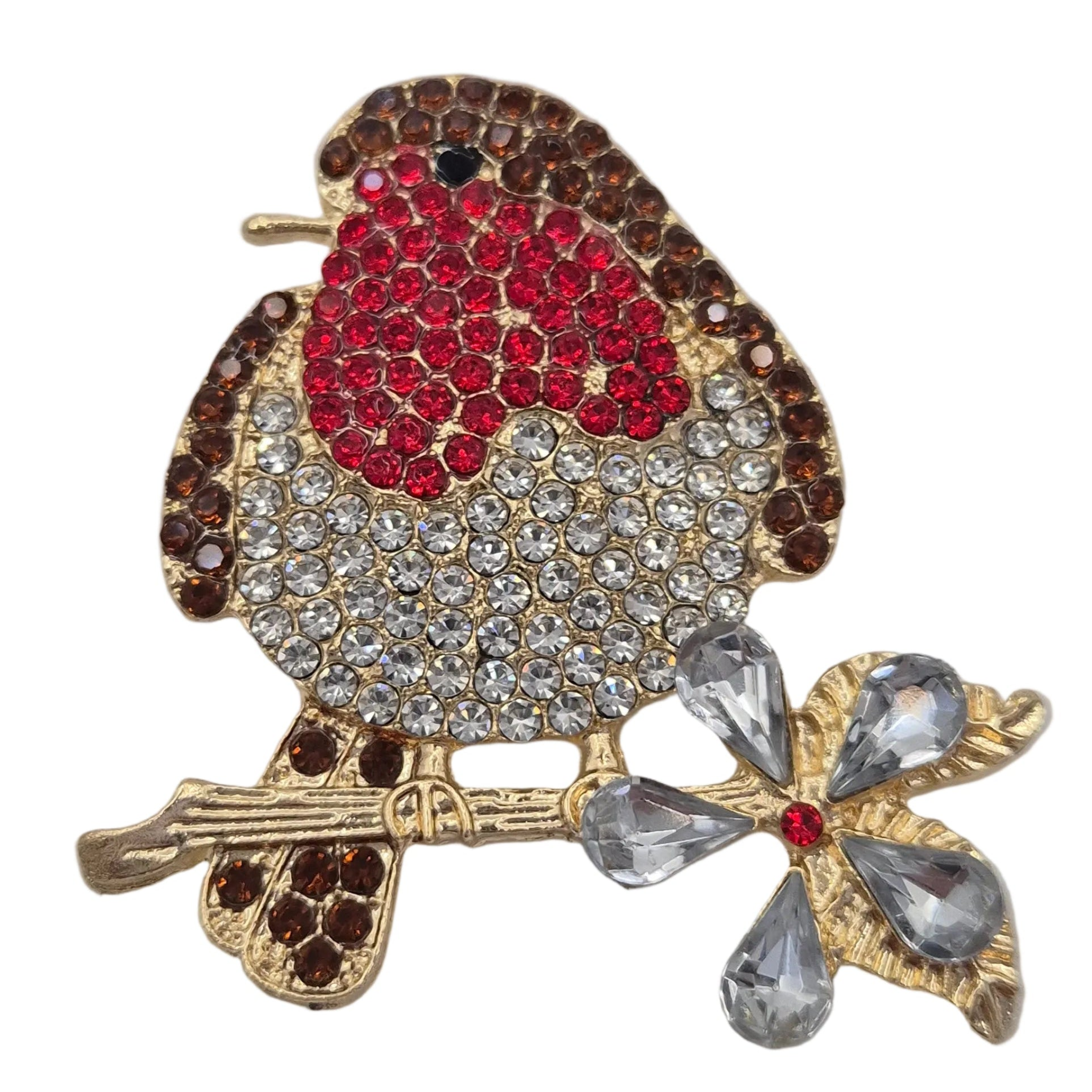A gold-tone robin bird brooch embellished with red, brown, and clear rhinestones, perched on a gold branch with a clear rhinestone flower. Shown on a plain white background.