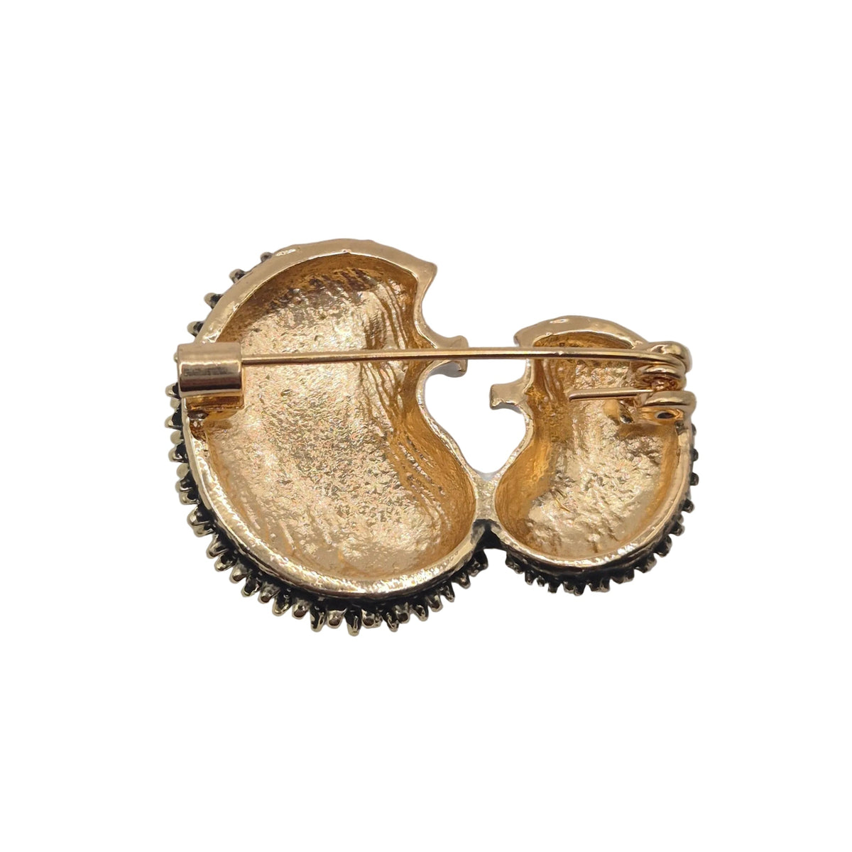 Reverse gold tone side of a double hedgehog brooch, displayed against a plain white background.