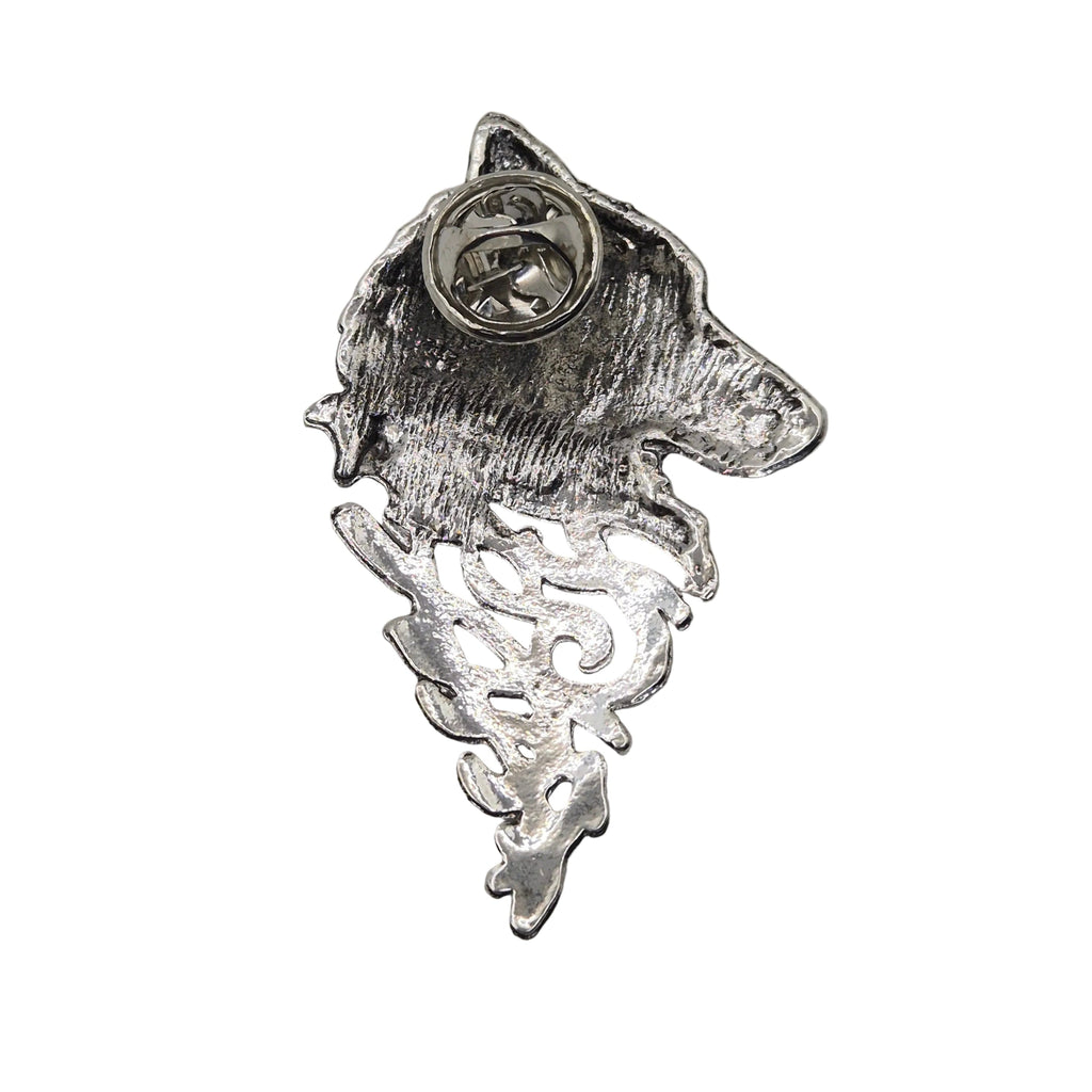 A silver metal pin shaped like a wolf's head with a textured, hammered finish and a circular pin backing visible at the top, shown on a plain white background.