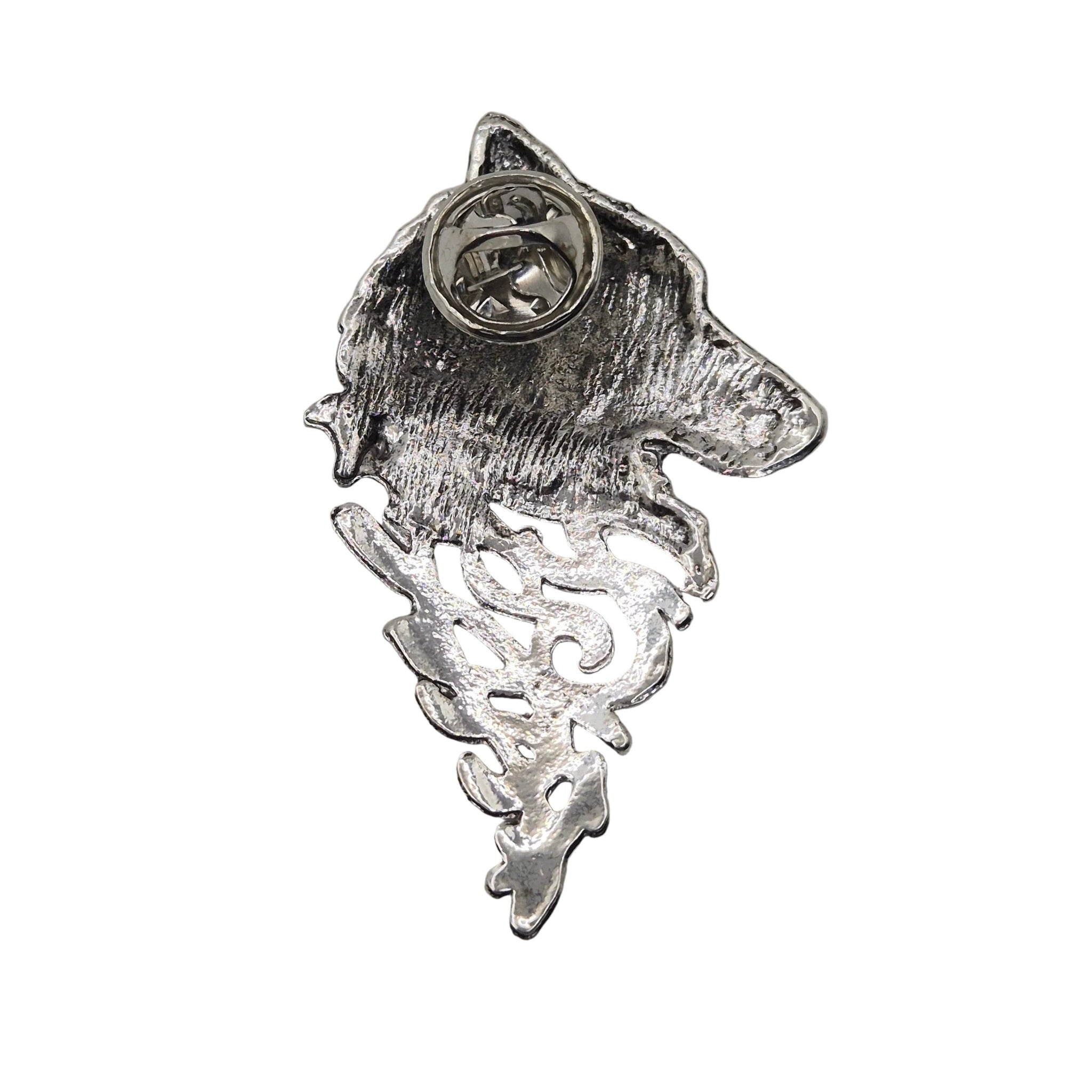 A silver metal pin shaped like a wolf's head with a textured, hammered finish and a circular pin backing visible at the top, shown on a plain white background.