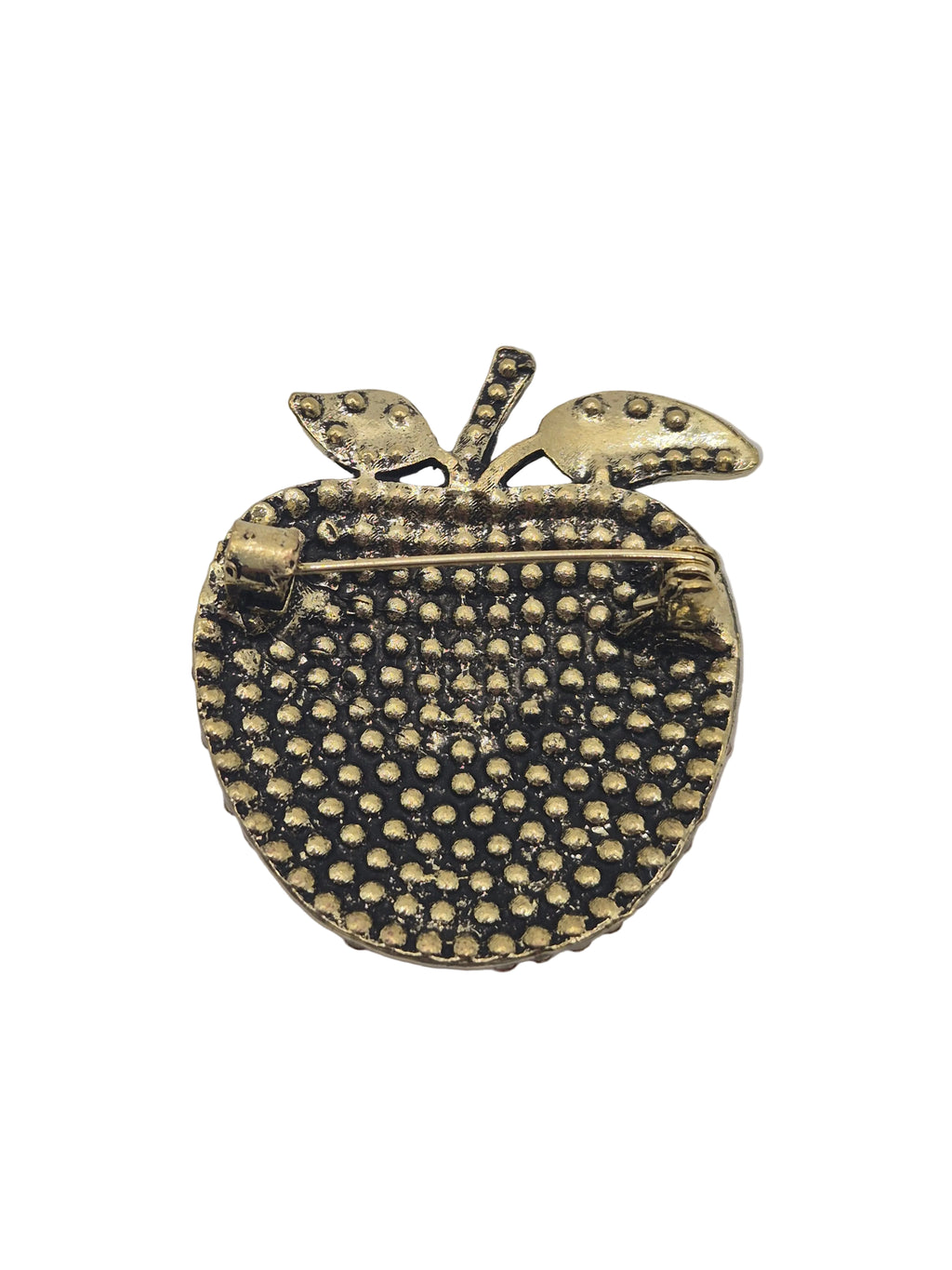 red apple-shaped brooch with textured surface on a white background