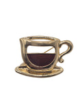 Gold metal coffee cup on white background