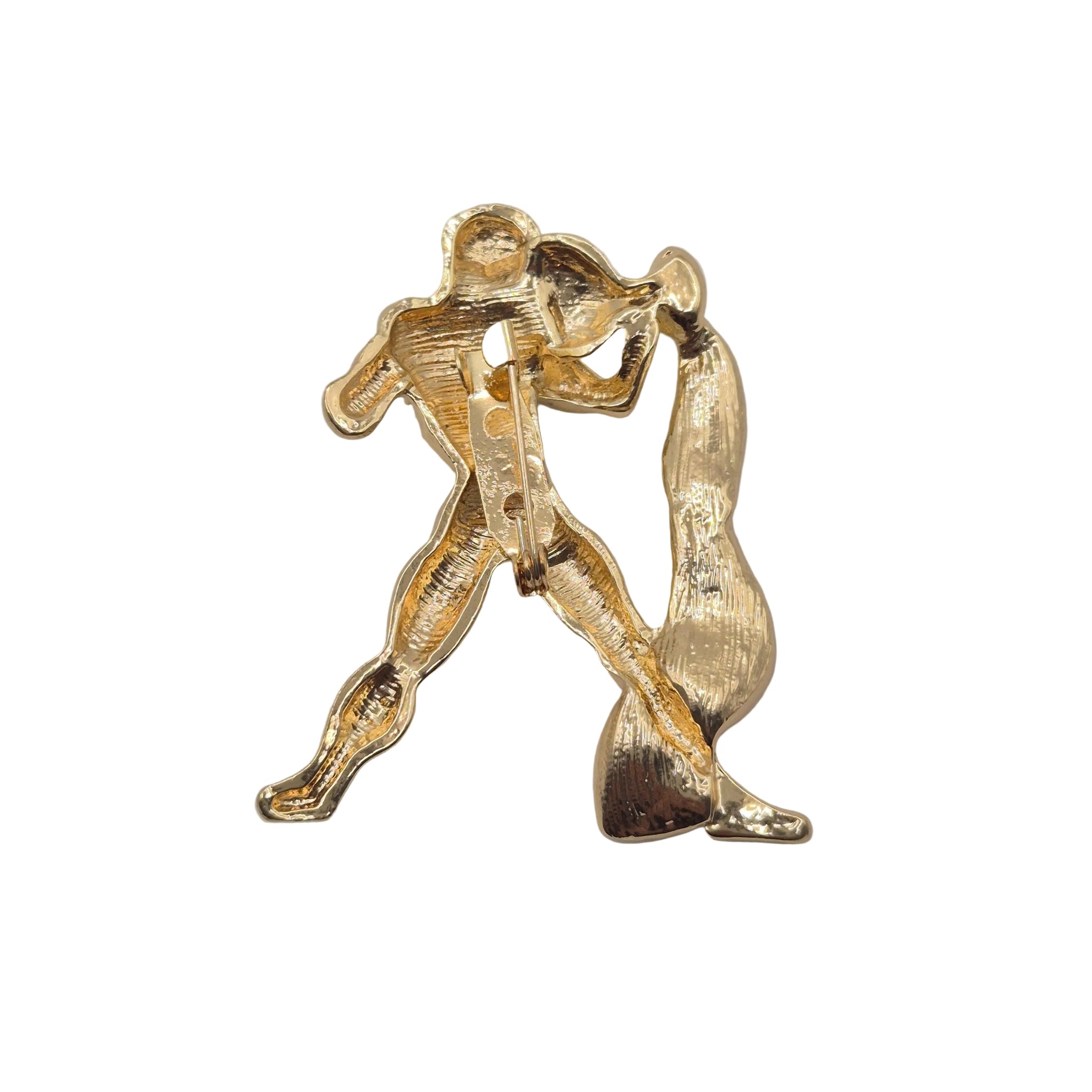 Gold tone metal aquarius brooch, shown against a plane white background. Shown from reverse side showing the pin mechanism.