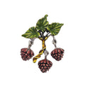 A vintage-style enamel brooch shaped like a branch with pinecones, green leaves, a yellow-green stem, and three dangling brown pinecones on silver-tone metal.