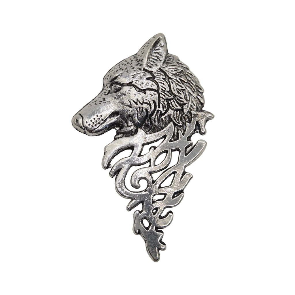 A silver-toned metal brooch featuring a detailed wolf head in profile with ornate scrollwork below, shown on a plain white background.