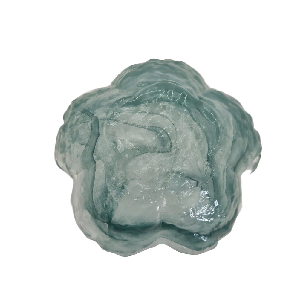 A scalloped glass bowl or trinket dish with a sage green wave design, shown on a plain white background.