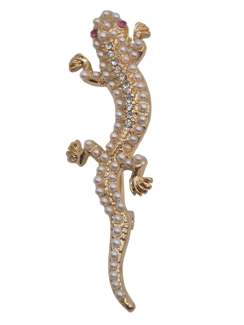 A gold gecko-shaped brooch embellished with white faux pearls, clear rhinestones, and small pink gemstones, shown against a plain white background.