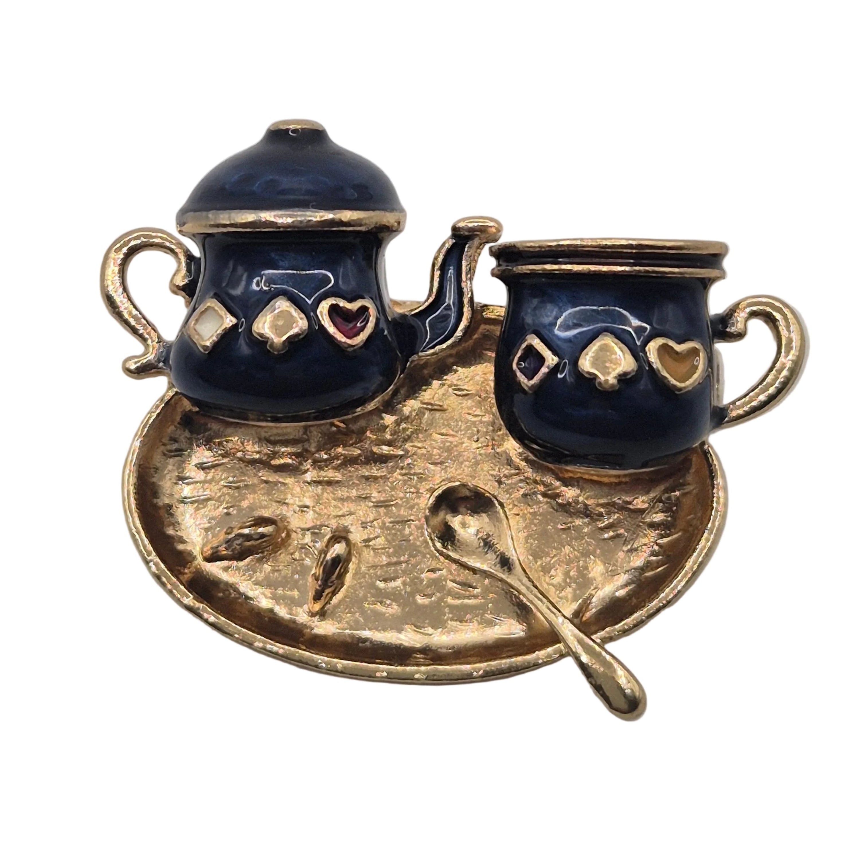A traditional Turkish style coffee pot and cup with gold-tone accents, displayed on a matching hammered gold tray with a small spoon, isolated on a white background.