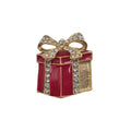 A small gift box brooch or charm with red enamel, gold-tone metal outlines, and clear rhinestones on the bow and edges, shown on a plain light background.