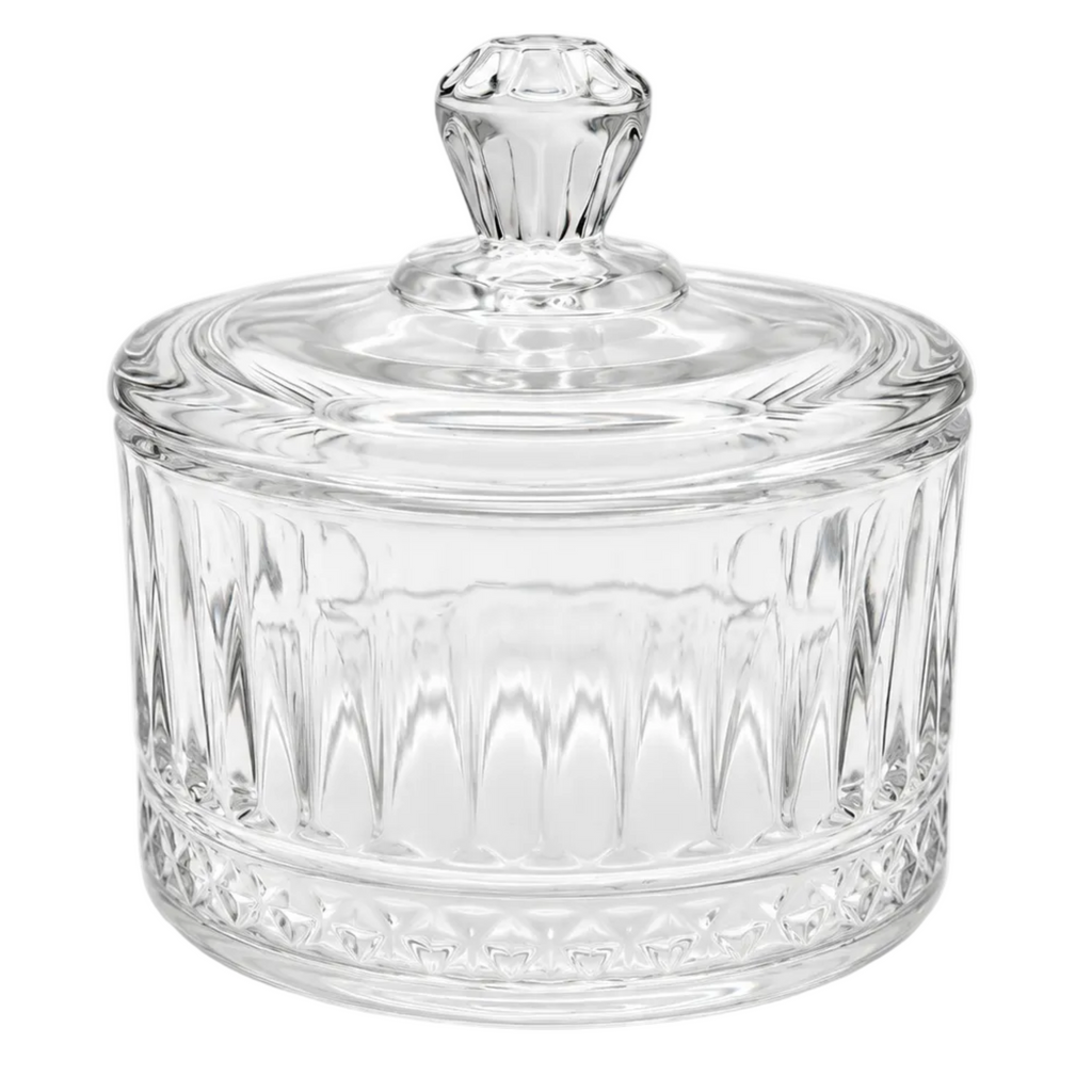 Clear glass lidded jar with a faceted knob top and vertical ribbed pattern on a white background.