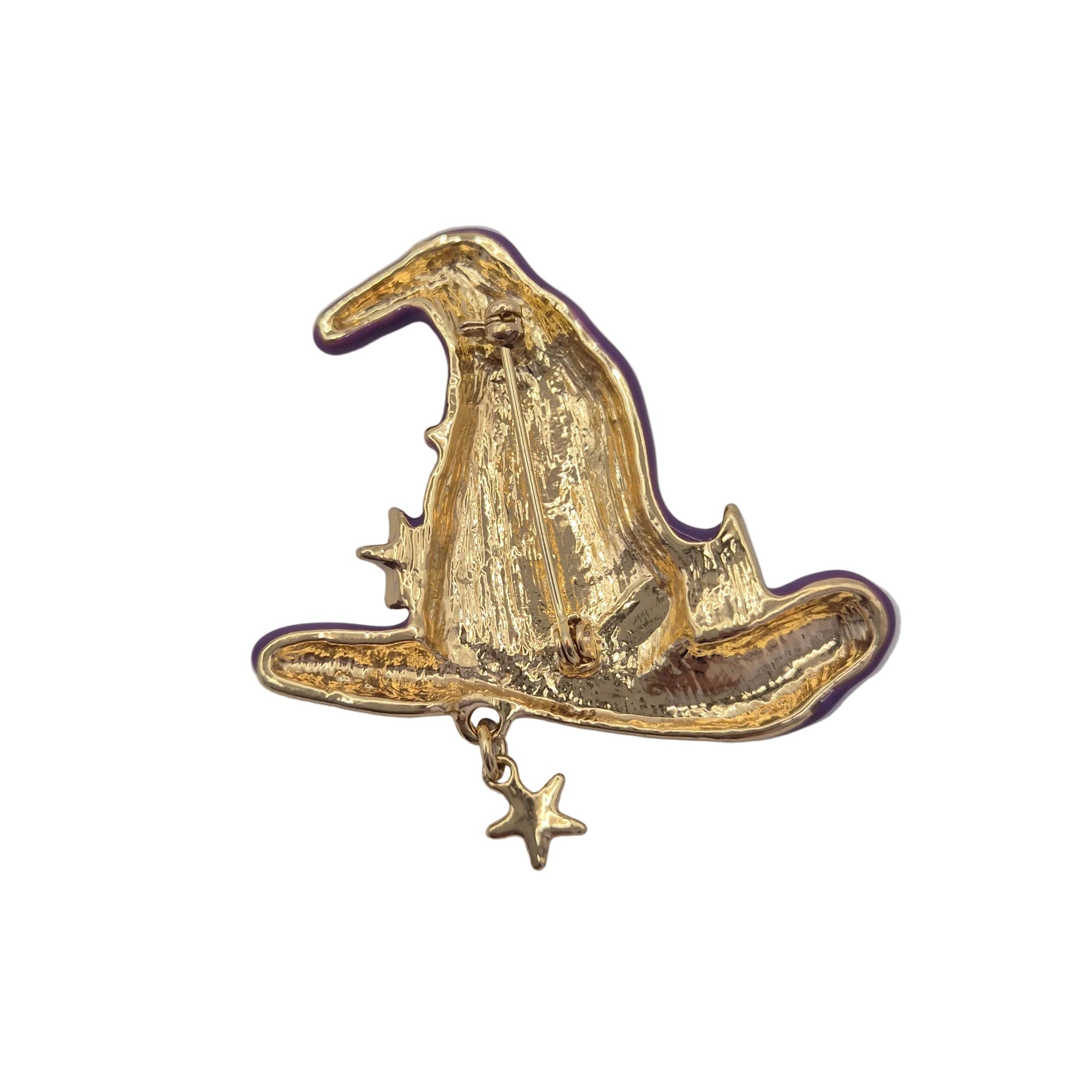 A gold witch hat brooch with a dangling star charm, shown on a plain white background.