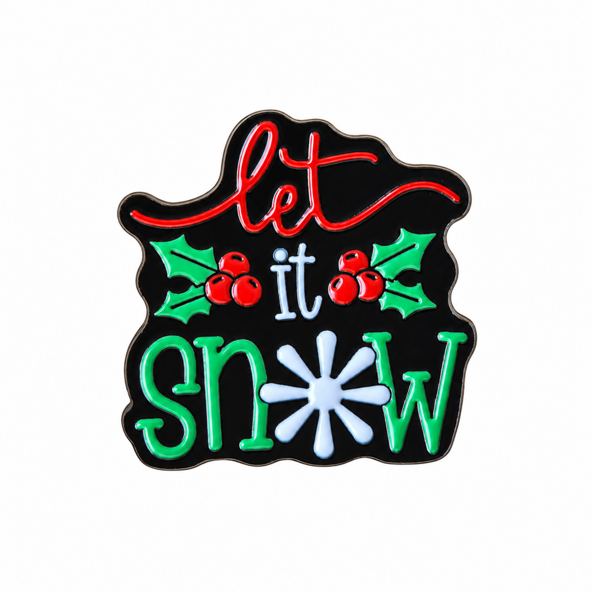 A Christmas-themed enamel pin with the phrase 'let it snow' on a black background, featuring red lettering, green holly leaves and berries, and a white snowflake.