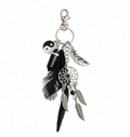 A silver-toned metal keychain charm featuring a lobster clasp, a dreamcatcher wheel, multiple feather charms, and a black-and-white yin-yang symbol charm, shown against a plain white background.