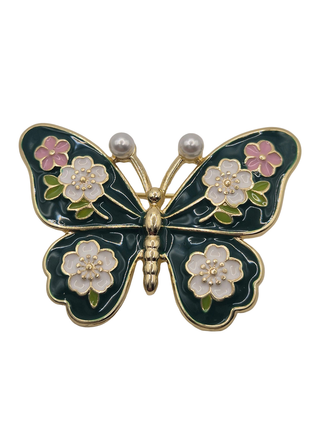 Butterfly brooch with floral details on a white background