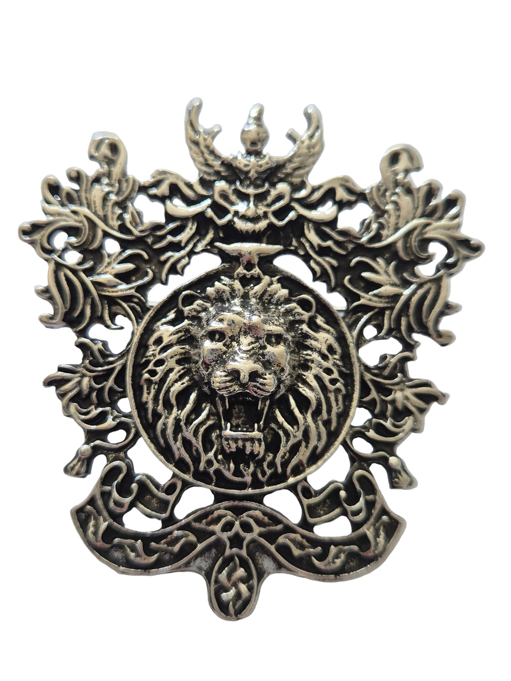 Metal brooch lion's head design on a white background