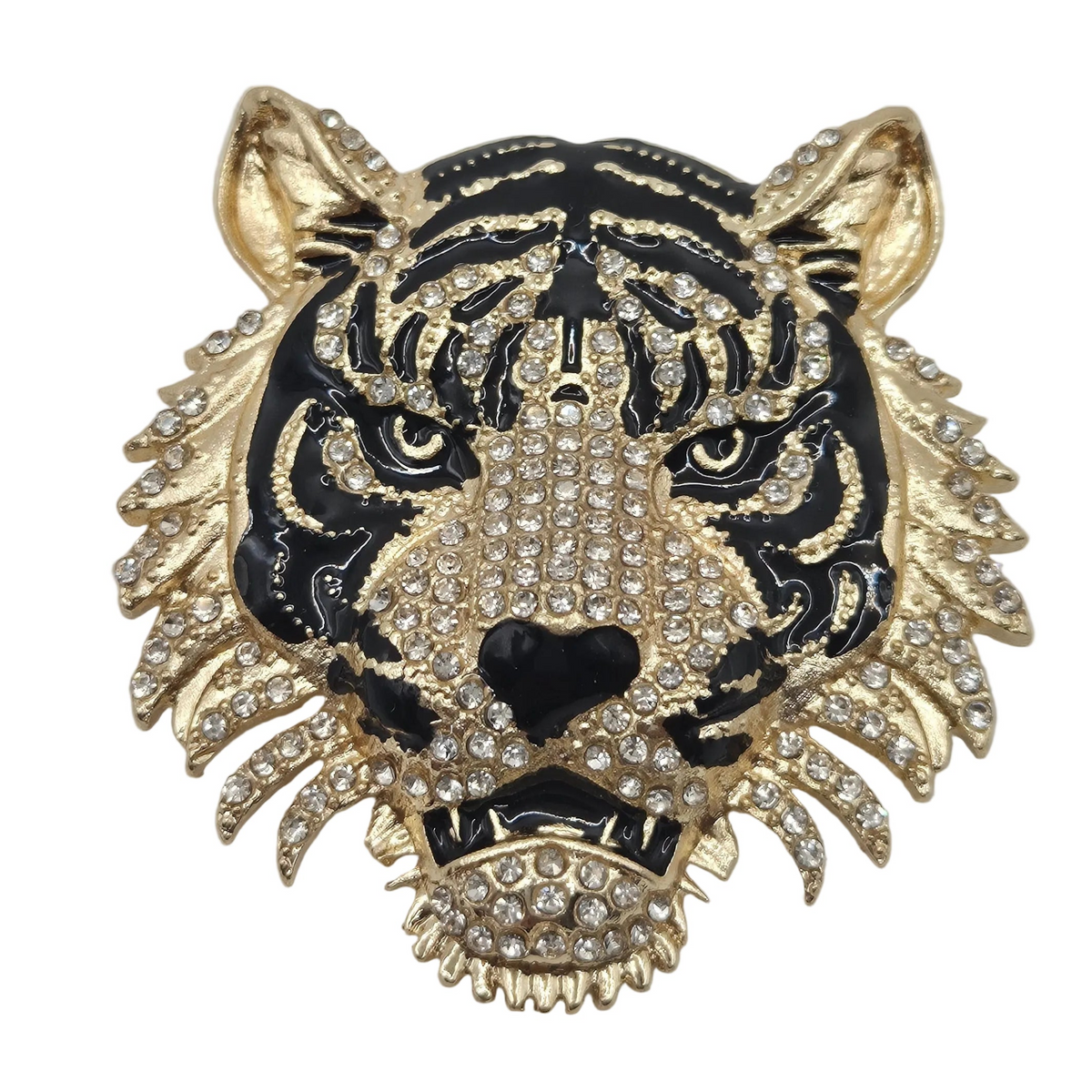 A gold and black tiger head brooch embellished with clear rhinestones, shown against a plain white background.