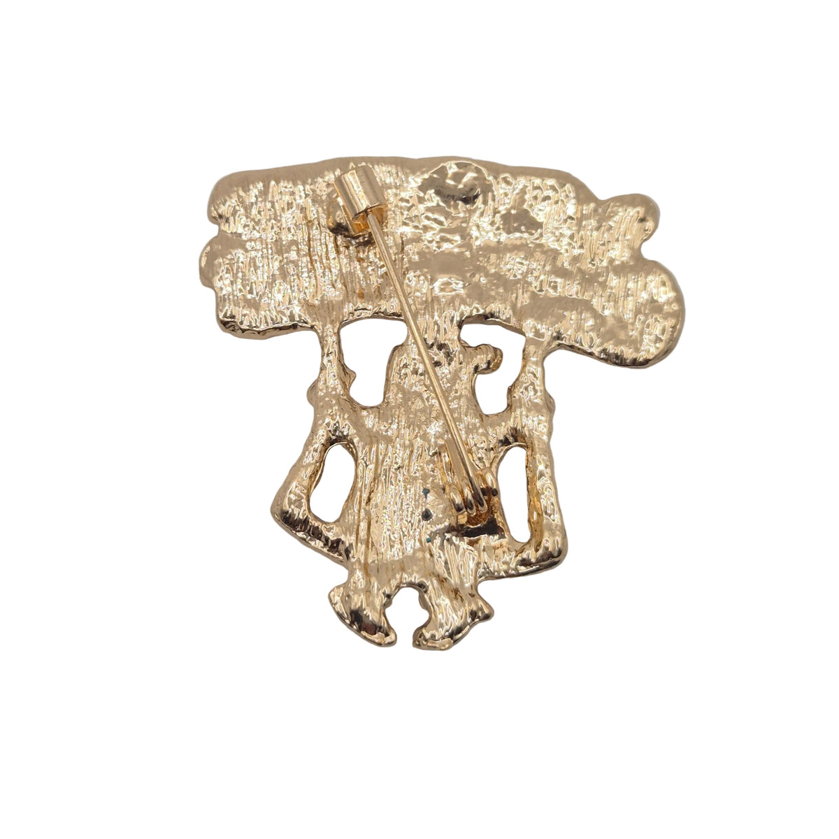 Reverse gold tone side of a Merry Christmas Santa brooch pin showing pin mechanism, displayed on a plain white background.