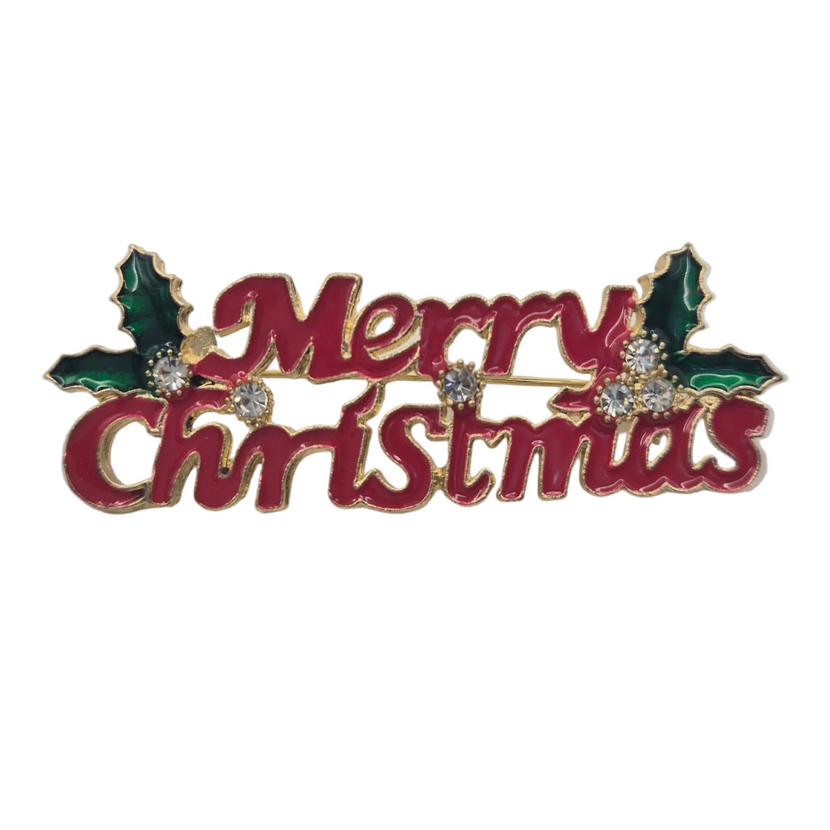 A 'Merry Christmas' metal pin featuring red cursive lettering, green holly leaves, and small clear rhinestones on a gold-tone base, set against a plain white background.