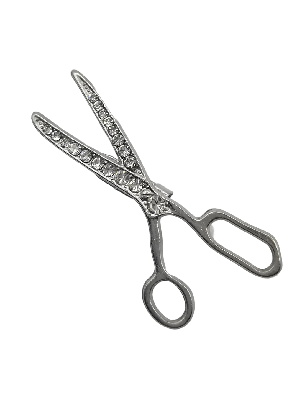 Silver scissors brooch with gemstones on a white background