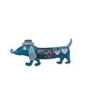 Blue dachshund dog brooch with hearts and floral design on  plain white background 