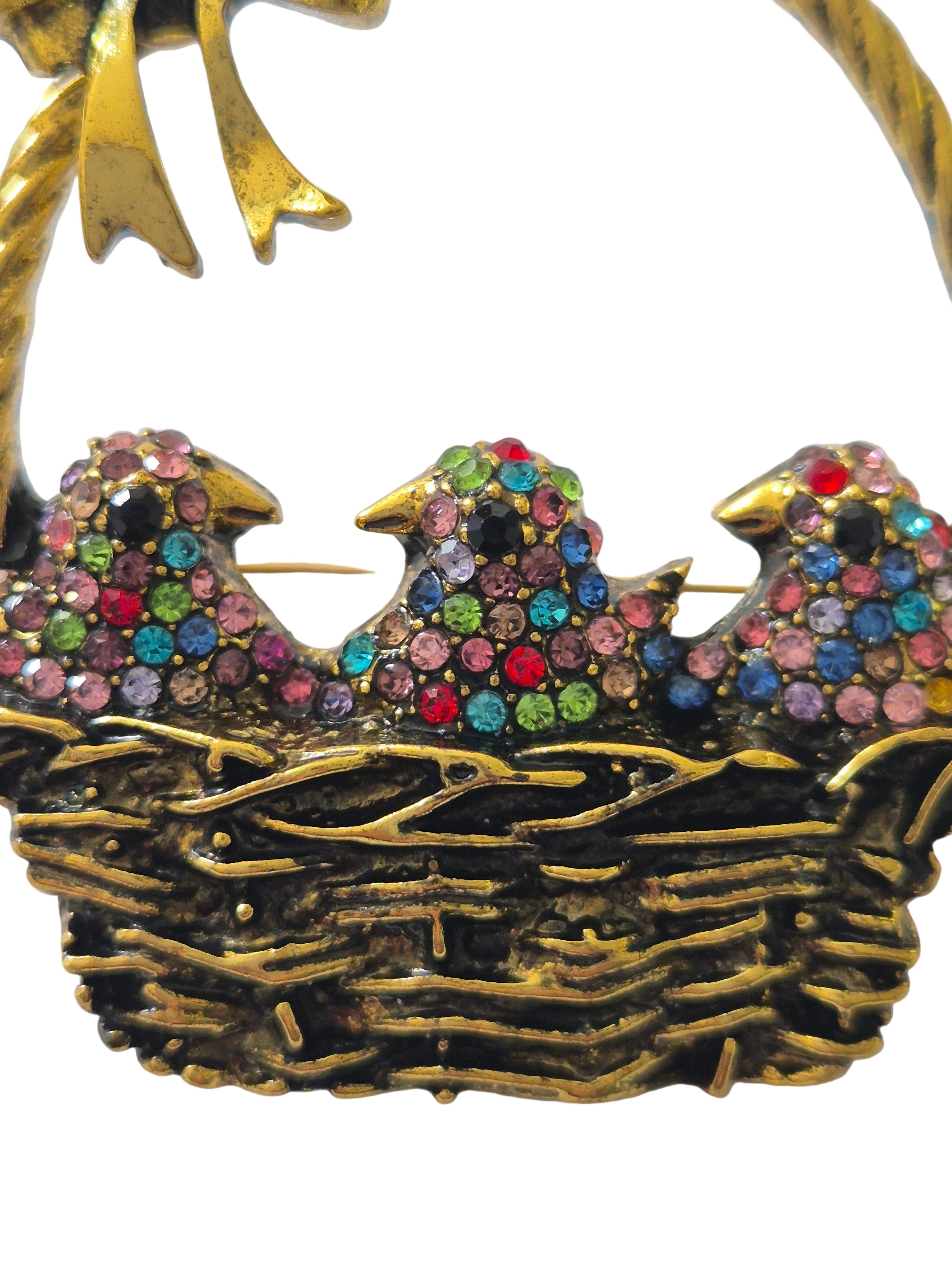 Decorative bird brooch with colorful gemstones 
