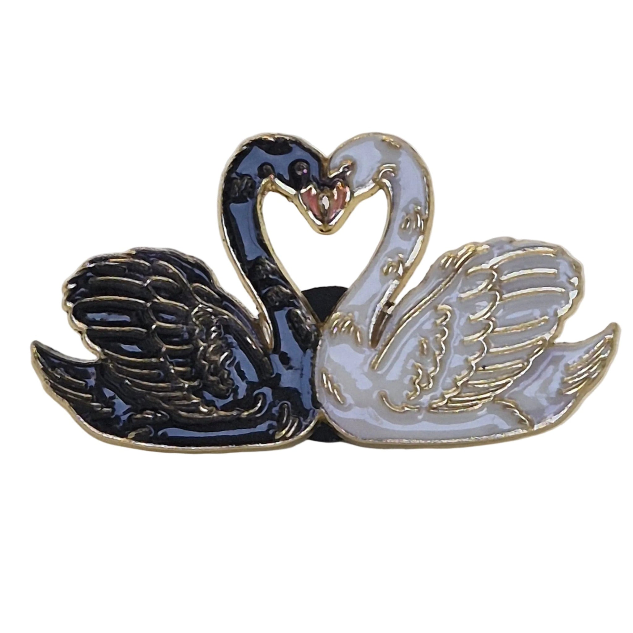 A twin swan enamel lapel pin featuring one black swan and one white swan facing each other in a heart-shaped pose with gold-tone metal outlines, set against a plain white background.