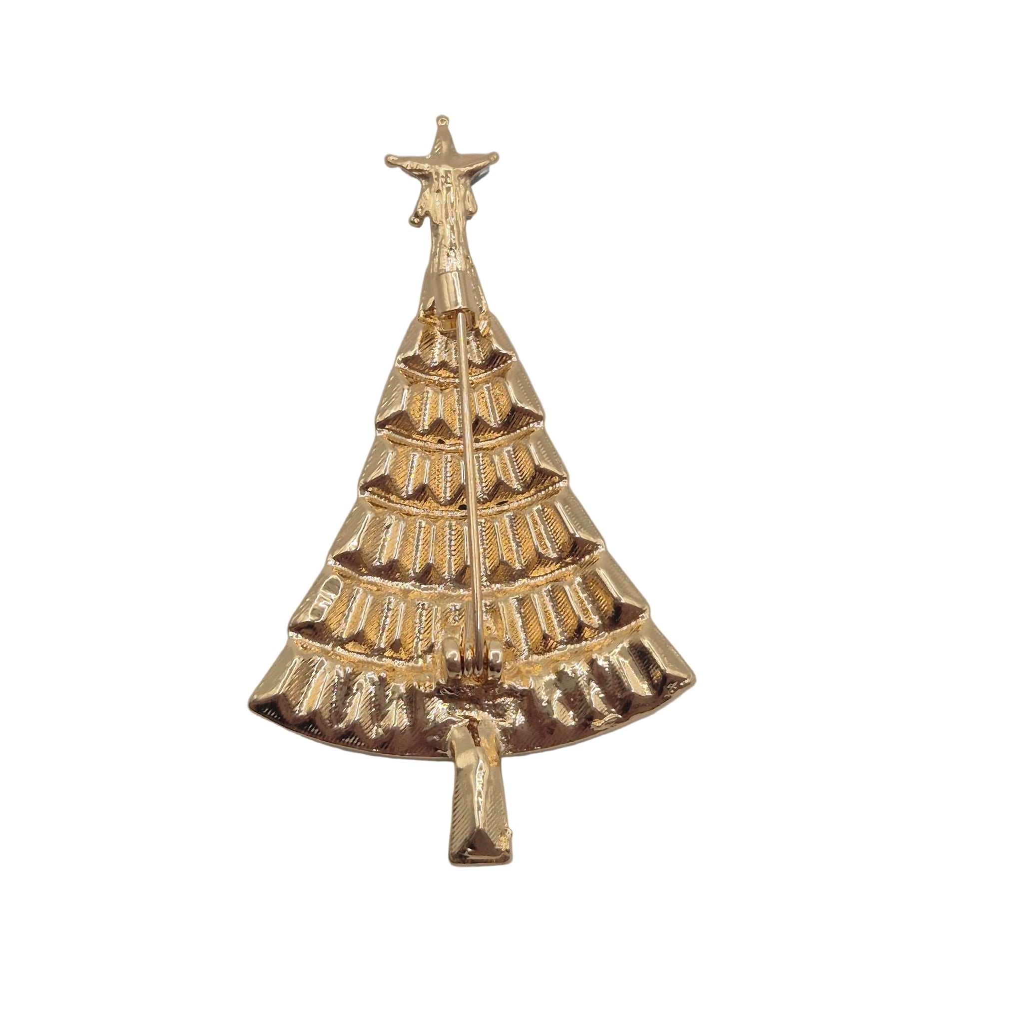 A gold Christmas tree-shaped brooch with a textured, tiered design and a star topper, shown on a plain white background.