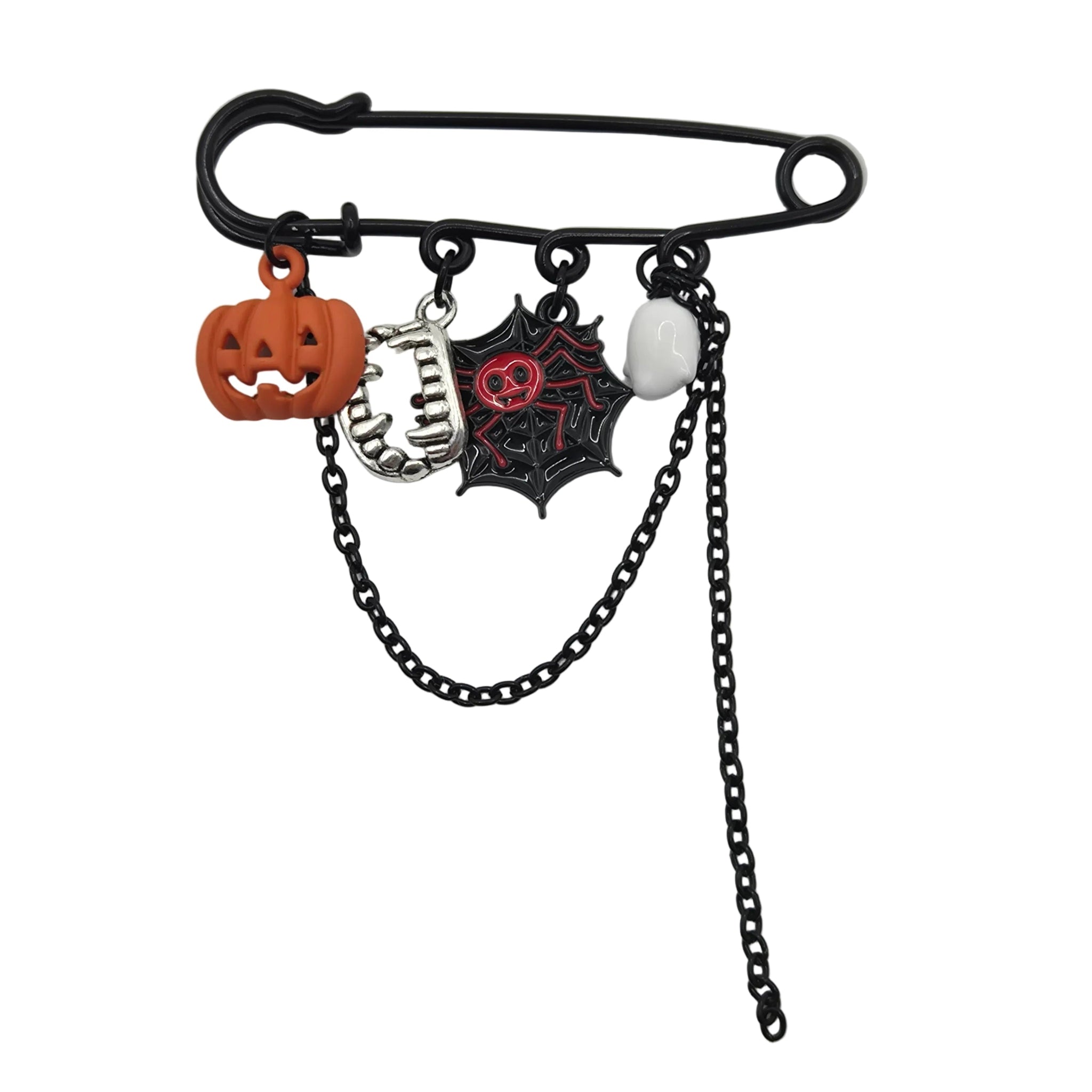 A black safety pin brooch with Halloween-themed charms, including a jack-o'-lantern, a skeleton hand, a black spiderweb with a red skull, and a dangling black chain, shown on a white background.