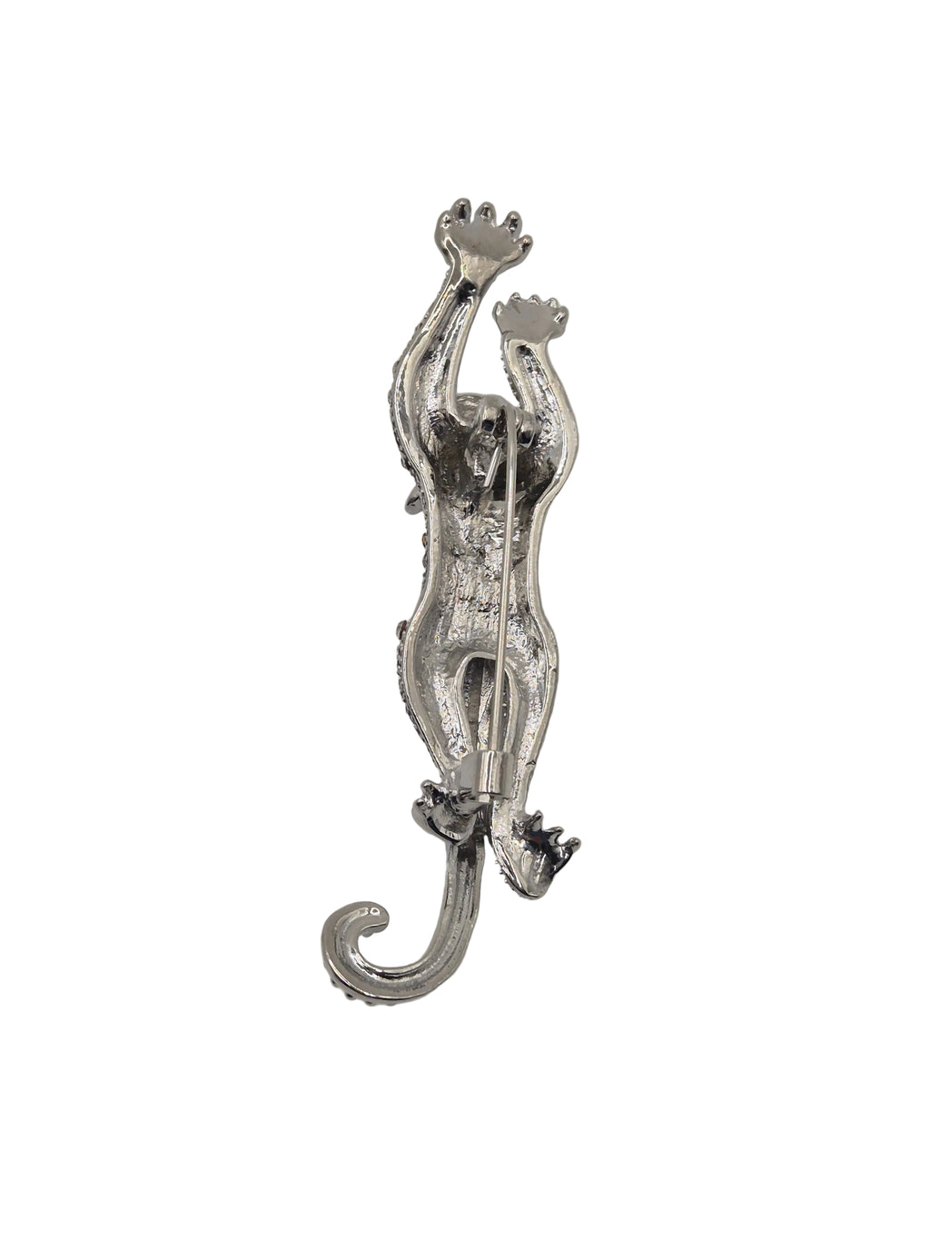 Silver tiger rhinestone brooch on a white background