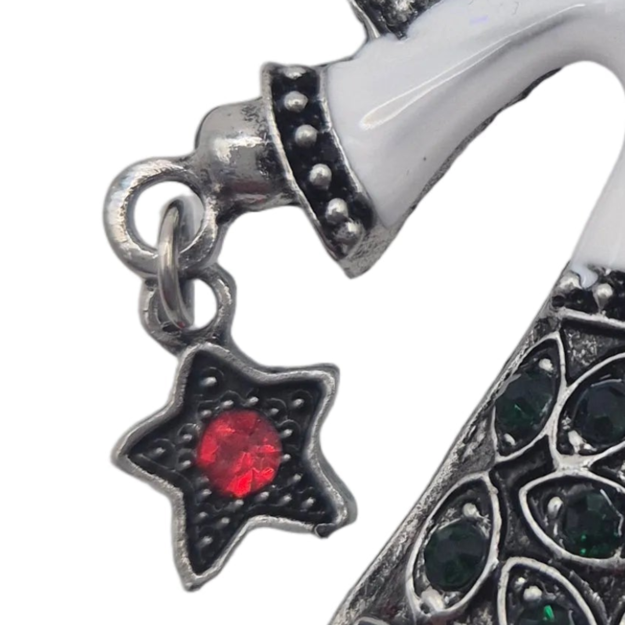 Silver-toned angel brooch with a dangling star-shaped accent featuring a red gemstone, shown against a white background.