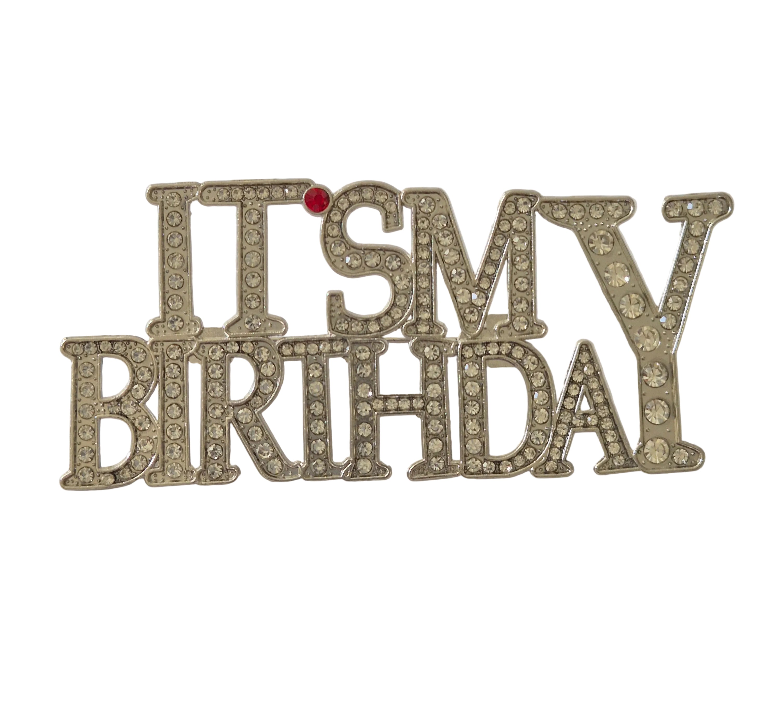 Decorative brooch with 'It's My Birthday' text on a plain background
