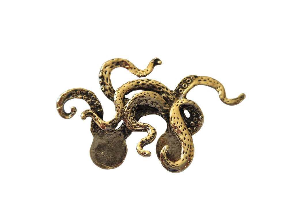 Bronze octopus brooch charm on a light gray background
