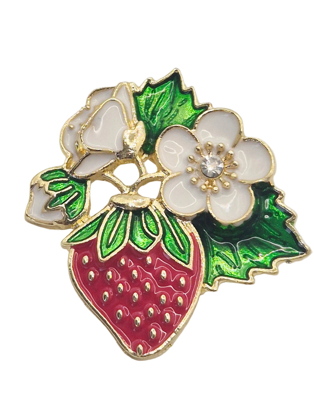A red and white strawberry fruit and flowers brooch on a plain white background. 