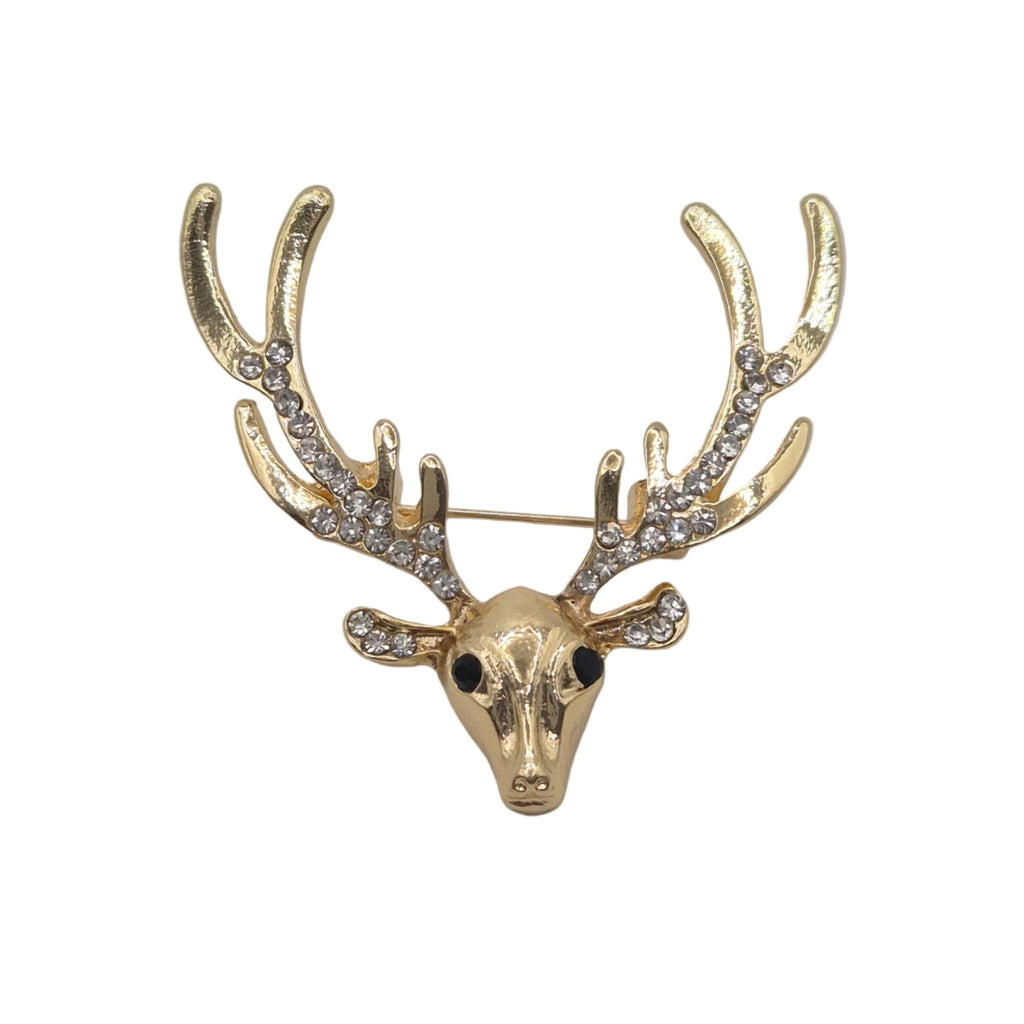 A gold deer head brooch with antlers adorned with clear rhinestones, photographed on a plain white background.