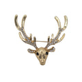 A gold deer head brooch with antlers adorned with clear rhinestones, photographed on a plain white background.