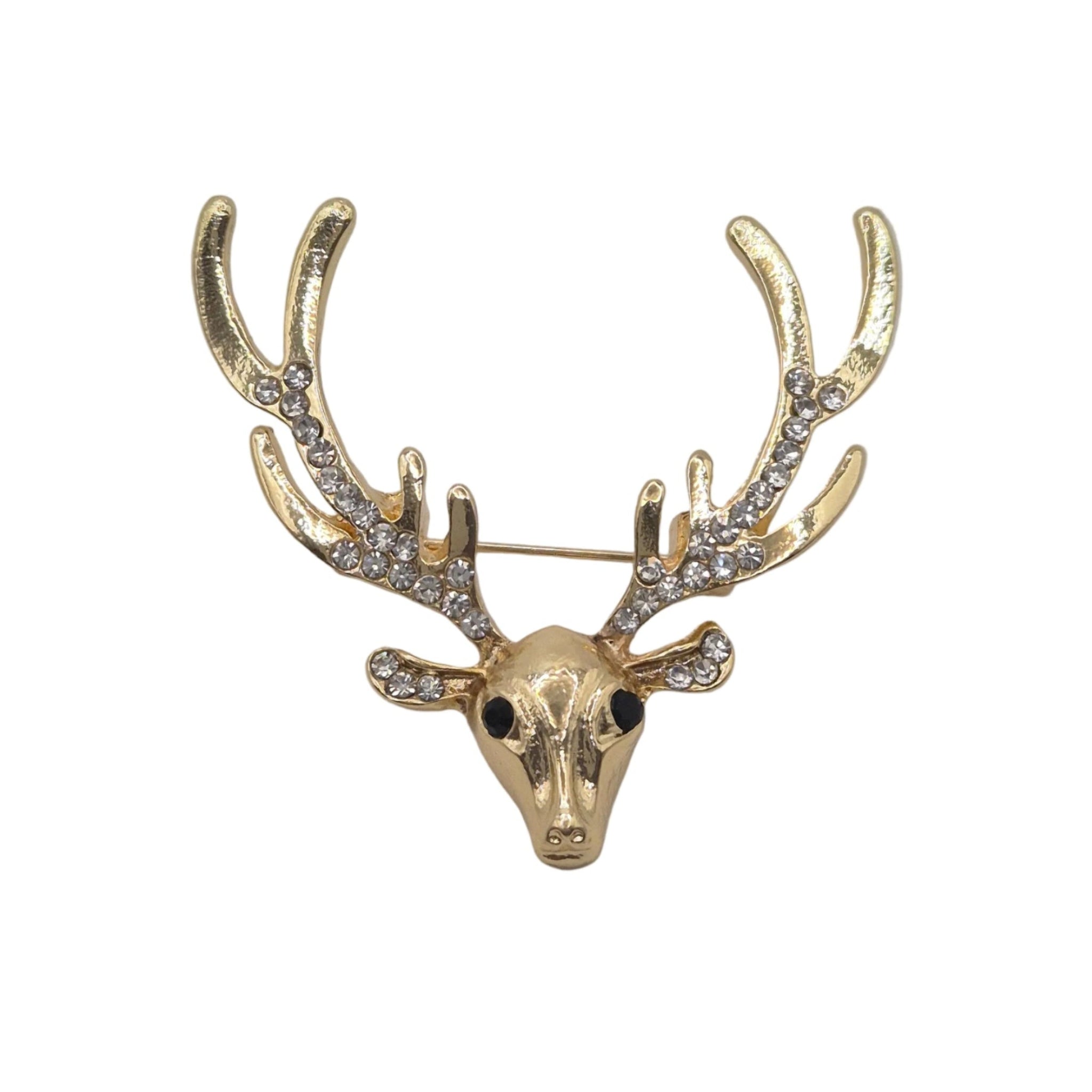 A gold deer head brooch with antlers adorned with clear rhinestones, photographed on a plain white background.