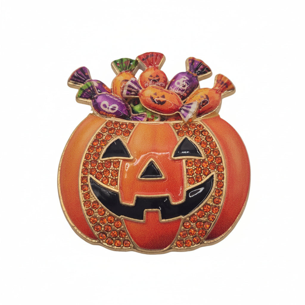 A Halloween-themed enamel pin shaped like a jack-o'-lantern pumpkin with candy overflowing from the top, shown on a plain white background.