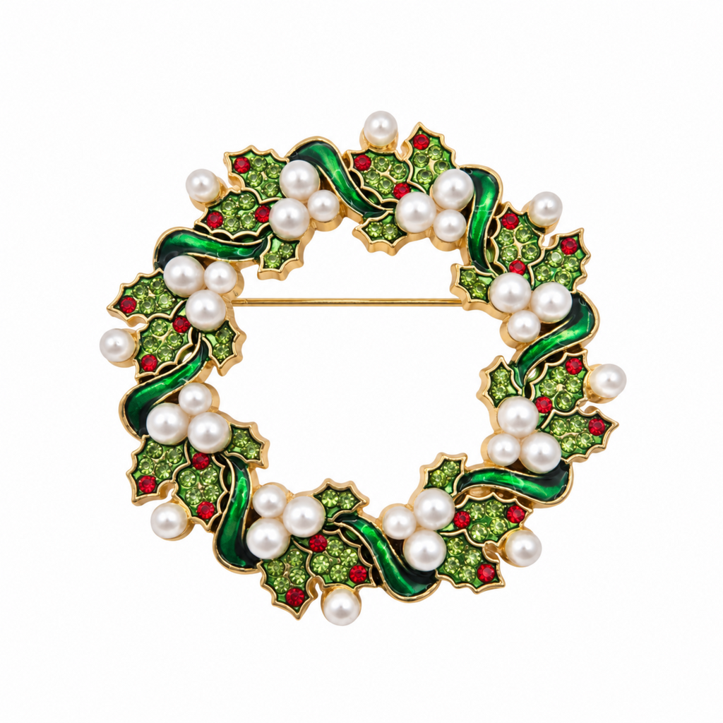 A circular gold-tone brooch designed as a holly wreath, featuring green enamel leaves, white faux pearls, and small red crystal accents on a plain white background.