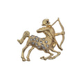 Sagittarius zodiac sign brooch. Gold tone with clear rhinestones. Shown against a plain white background. 