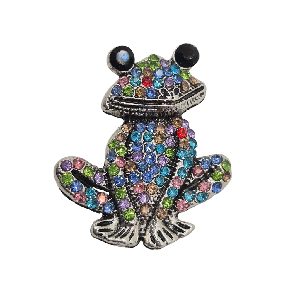Rhinestone Frog Brooch with multicolored gemstones on a gray background