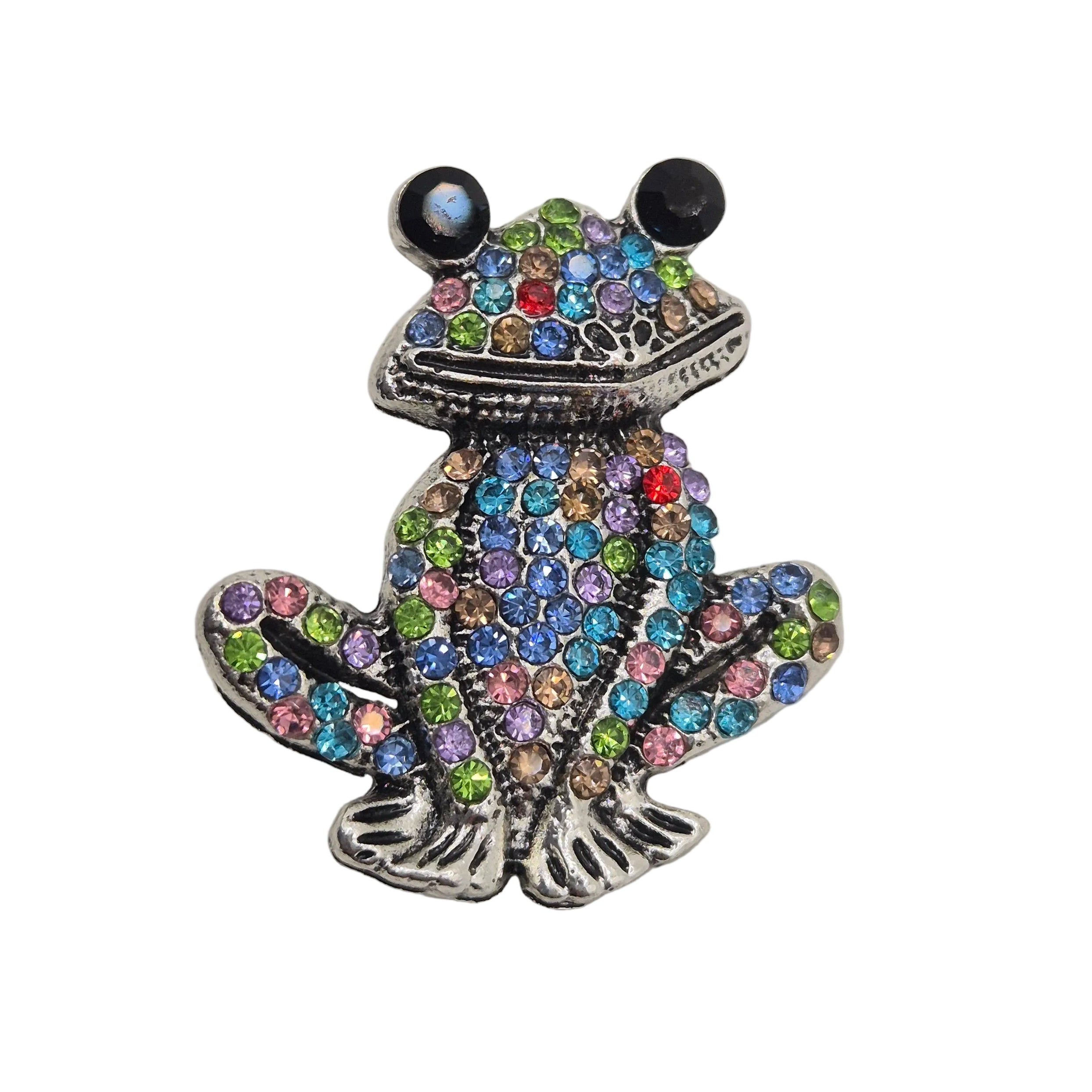 Rhinestone Frog Brooch with multicolored gemstones on a gray background