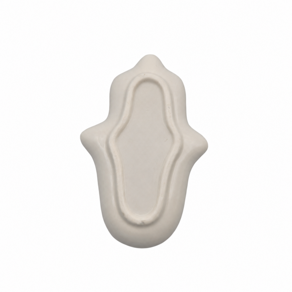 An off-white ceramic Hamsa hand trinket dish decor piece with a textured matte finish, shown against a plain white background.