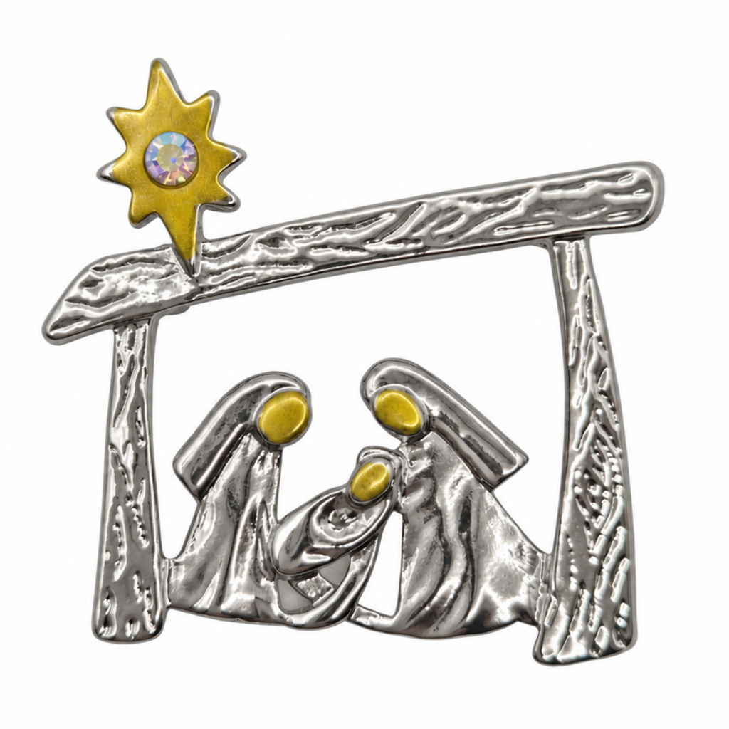 A silver-toned metal nativity scene  brooch pin featuring Mary, Joseph, baby Jesus, and a gold star with a central iridescent rhinestone, isolated on a white background.