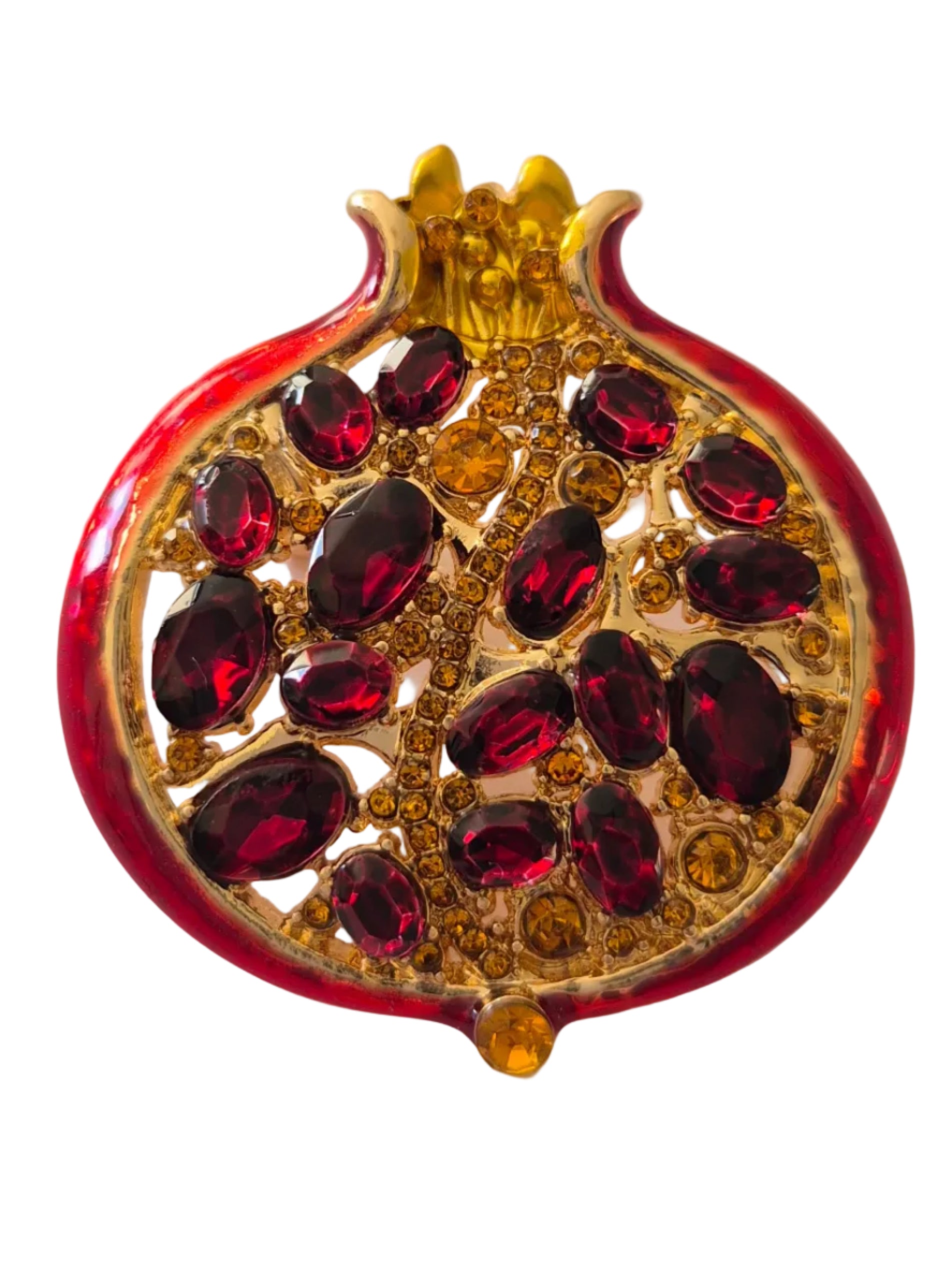 Pomegranate brooch with red gemstones and gold accents on a white background".